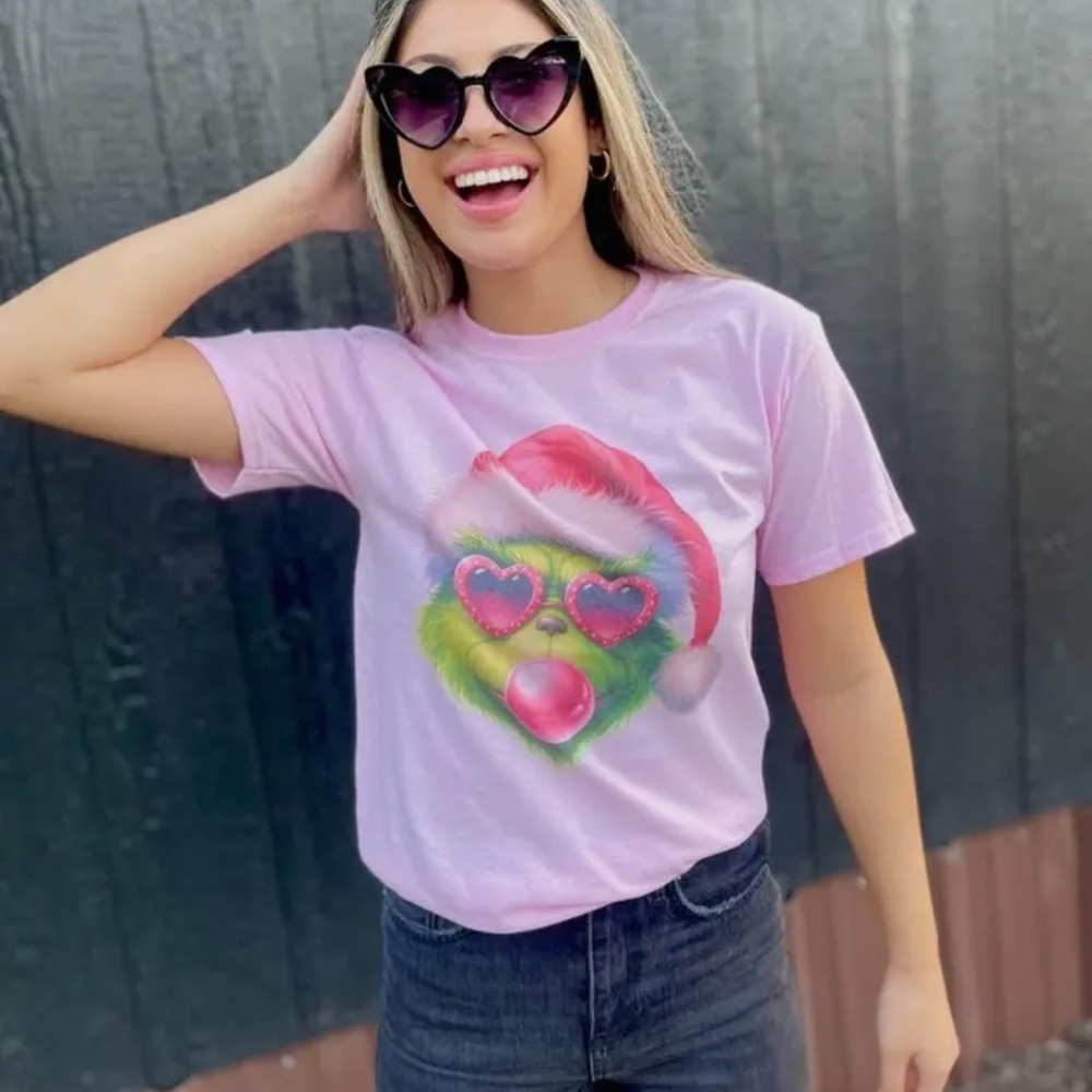 Pink Graphic T-Shirt with the Grinch Santa Hat Design